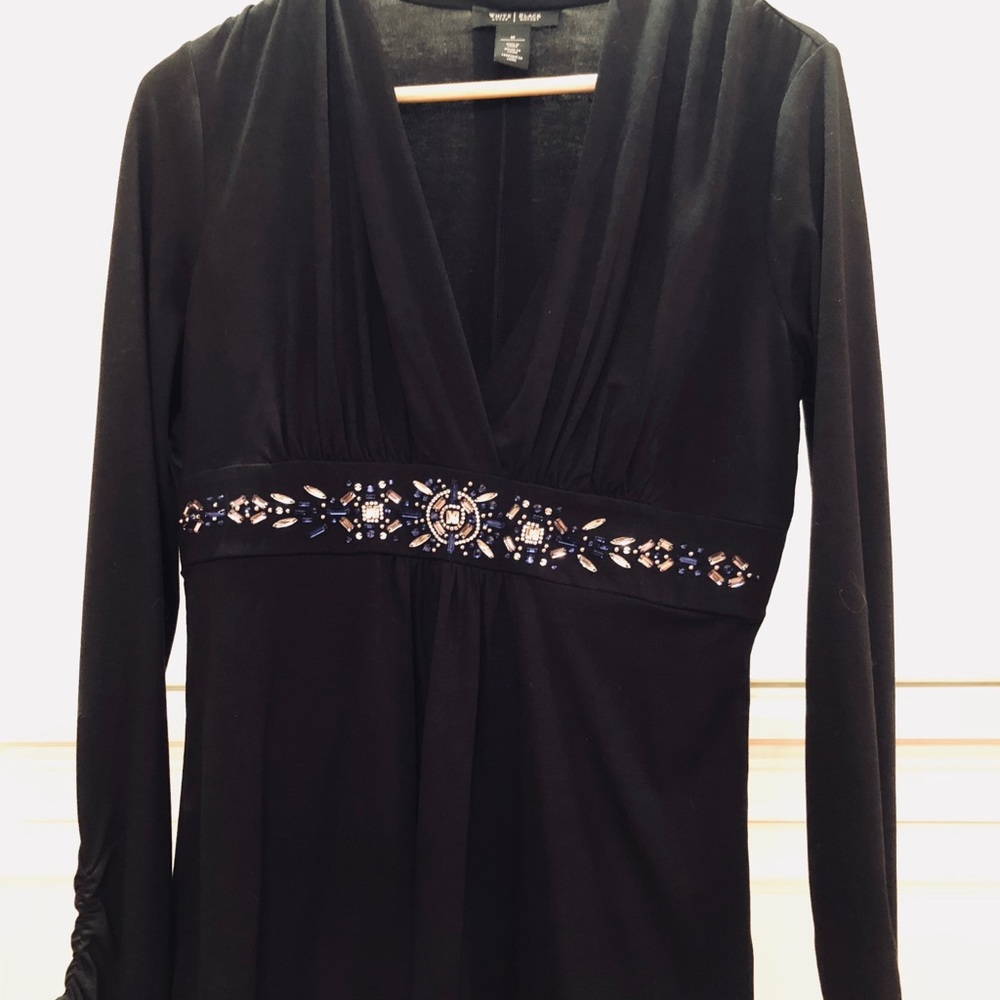 Black top trimmed in blue and white beads.